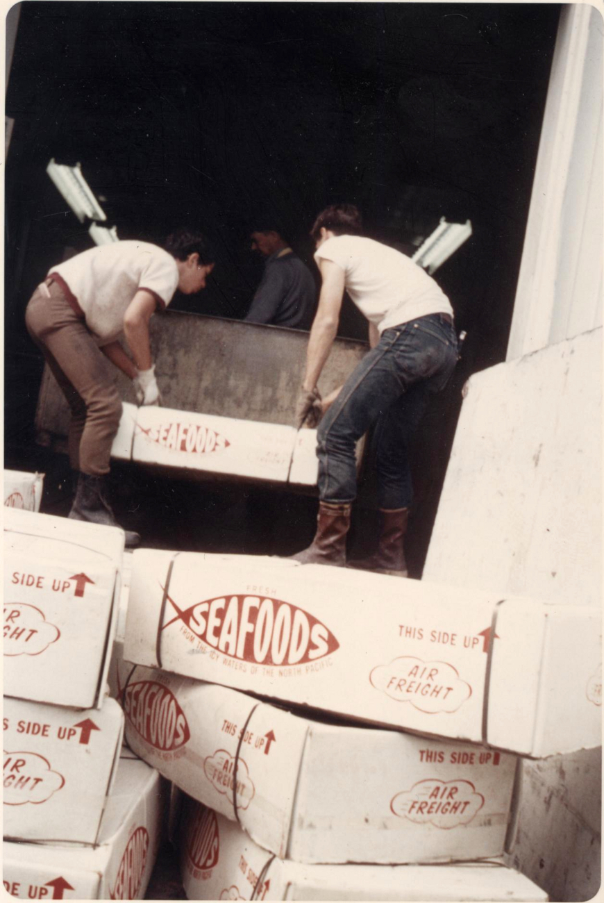 Air shipped salmon in-the-round being off-loaded at the Alaskan Frozen Productsplant