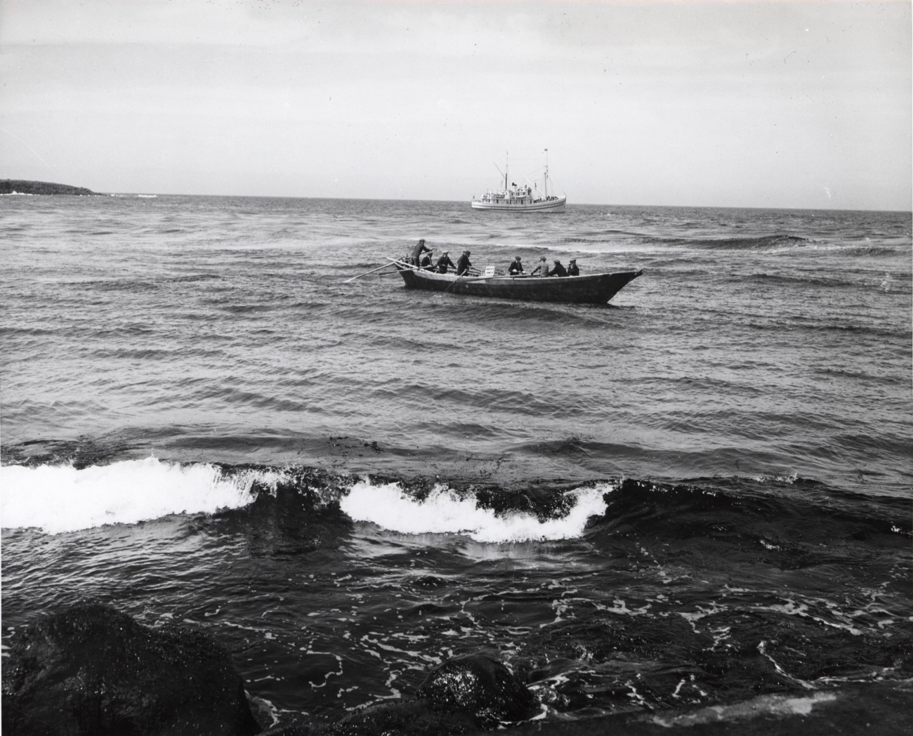A bidarrah, a large Eskimo skin-covered boat, ferrying supplies from U