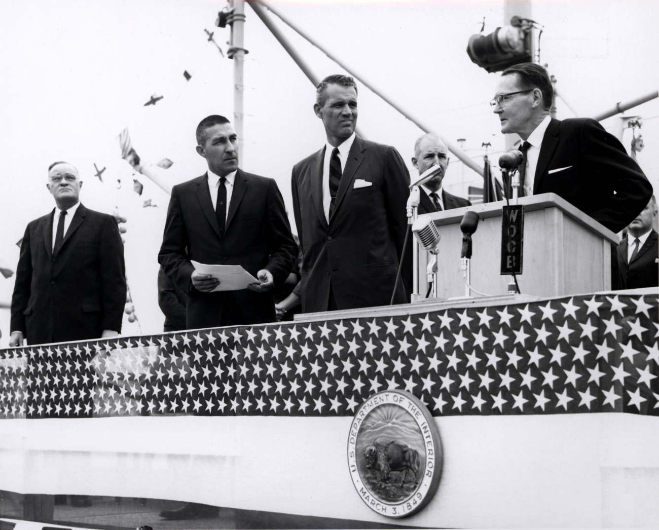 Speaker at dedication ceremony of ALBATROSS IV while Secretary of theInterior Stewart Udall (second from left) looks on