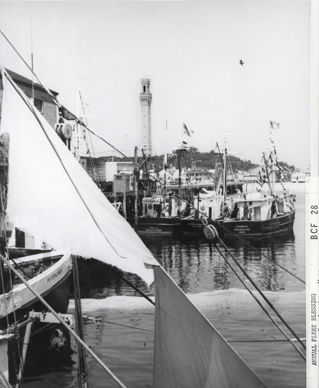 Fishing boats with Pilgrim Monument in the background