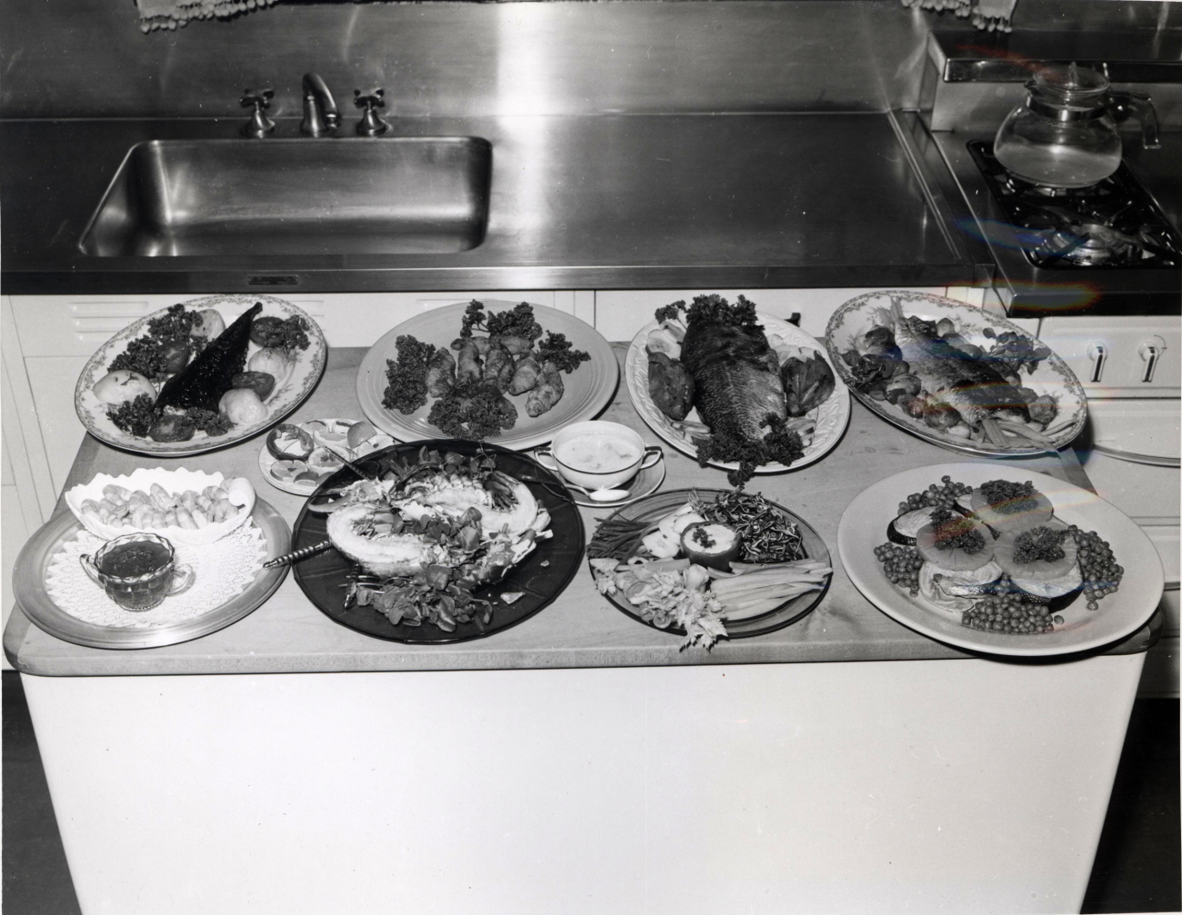 Fish platters encompassing many species of fish and shellfish designedby Miss Irene Hickey, Home Economics Director, Michigan ConsolidatedNatural Gas Co