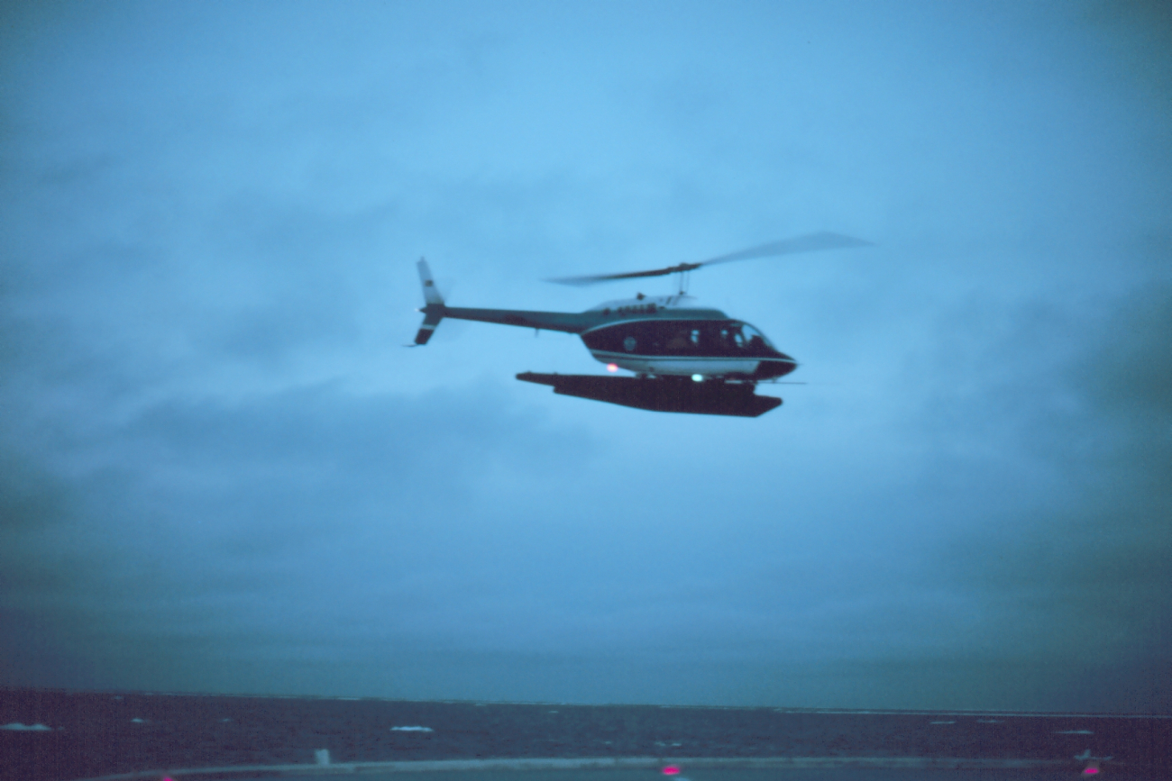 Lieutenant Budd Christman flying leased Bell 206 in Bering Sea