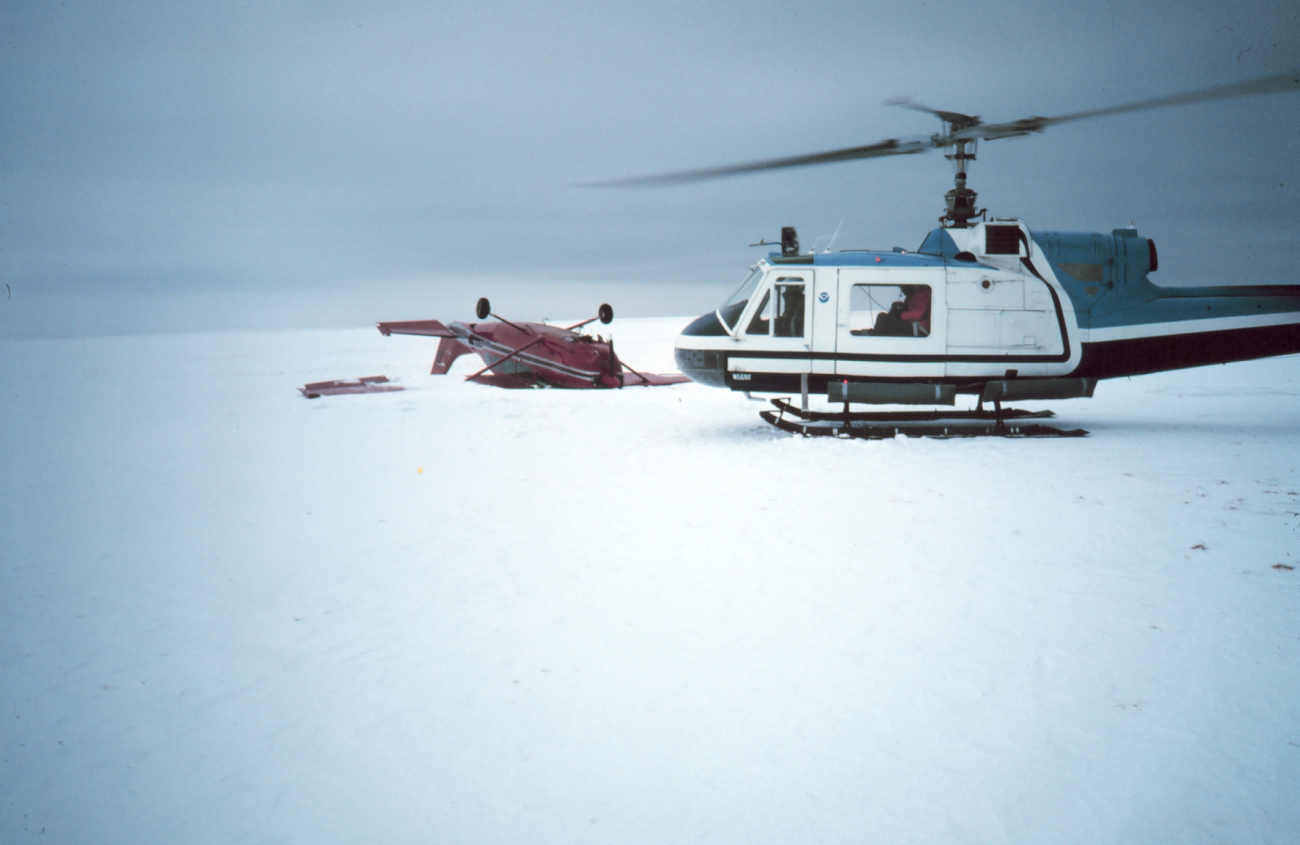 Inspecting crashed plane west northwest of Nome