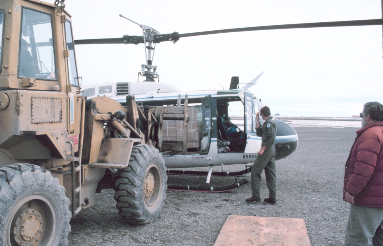 Loading Bell UH-1M helicopter with camp gear for bird studies in the Prudhoe Bay area