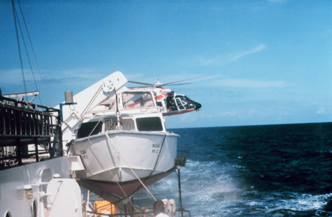 Coast Guard helicopter conducting medivac of NOAA Ship PEIRCE crewmanduring transit from Puerto Rico to Beaufort, North Carolina