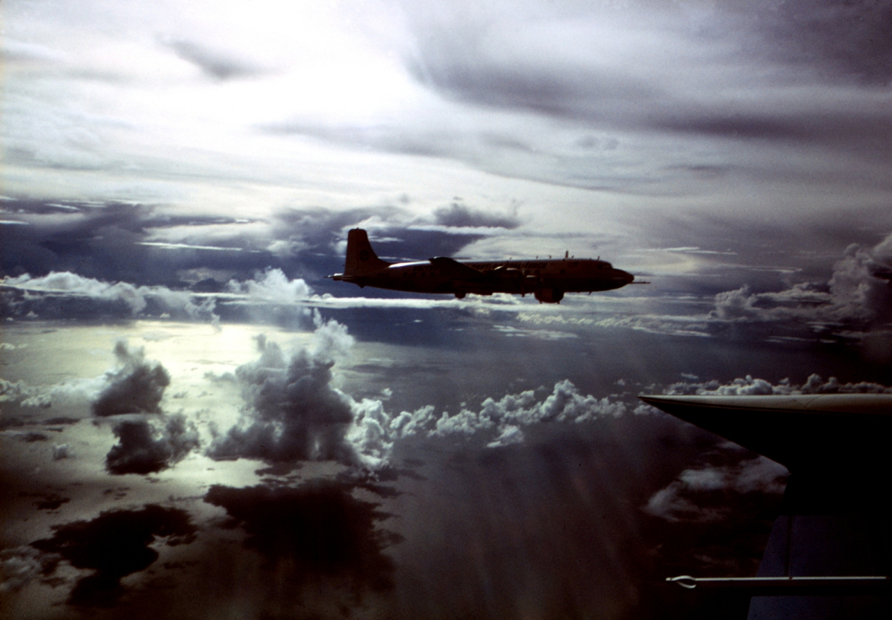 ESSA DC-6 hurricane research aircraft over the tropical Atlantic in lateafternoon sun
