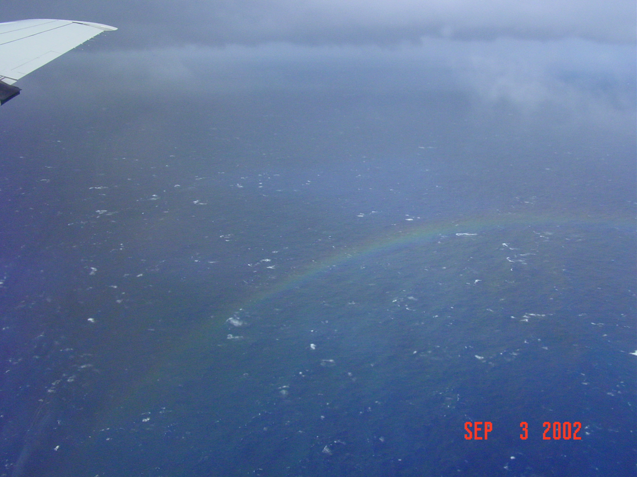 Rough seas and a rainbow seen from Miss Piggy, NOAA P-3 N43RF
