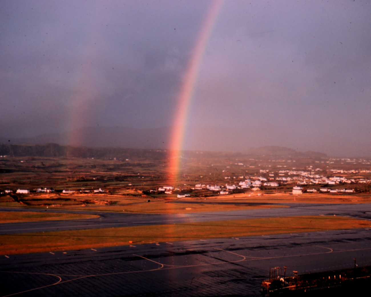 Double rainbow over an unknown airport