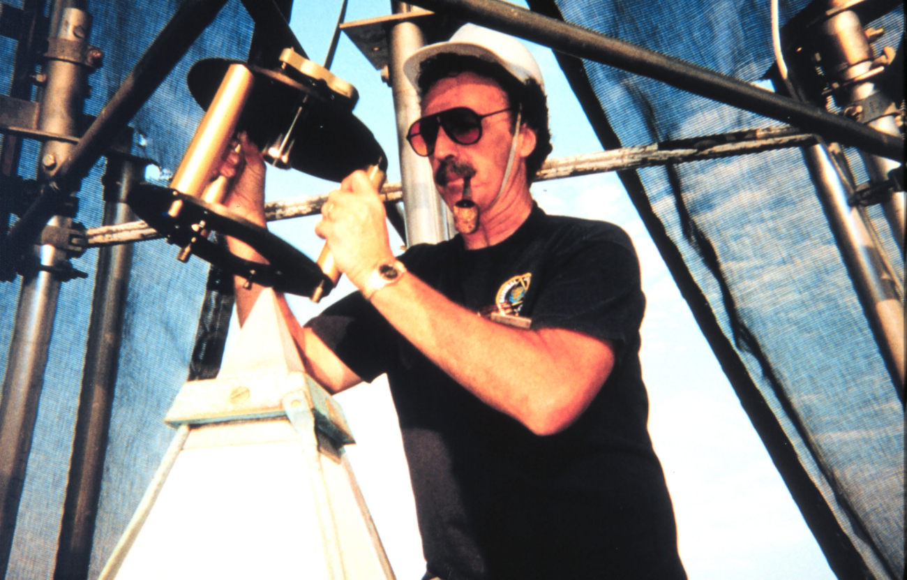 Roy Anderson of the National Geodetic Survey is setting up the mounting devicemanufactured by the National Institute of Standards and Technology for observing the top of the Washington Monument by GPS receivers