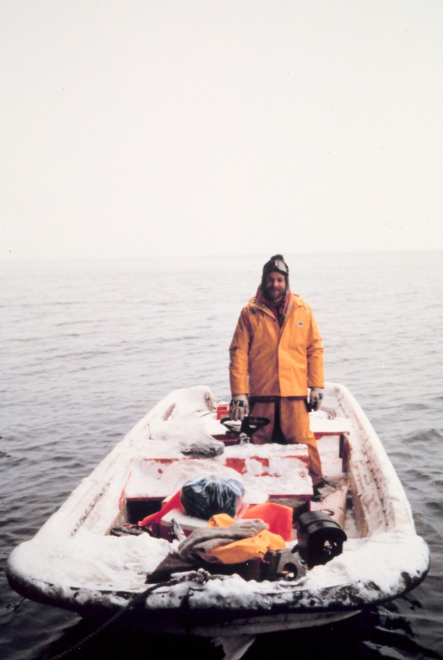 Seaman Surveyor Nick Piro standing in Boston Whaler