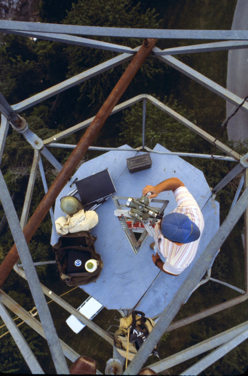 Ron Ramsey observing with a Wild T-3 theodolite as seen from the lightkeeper'splatform on the very top of the tower