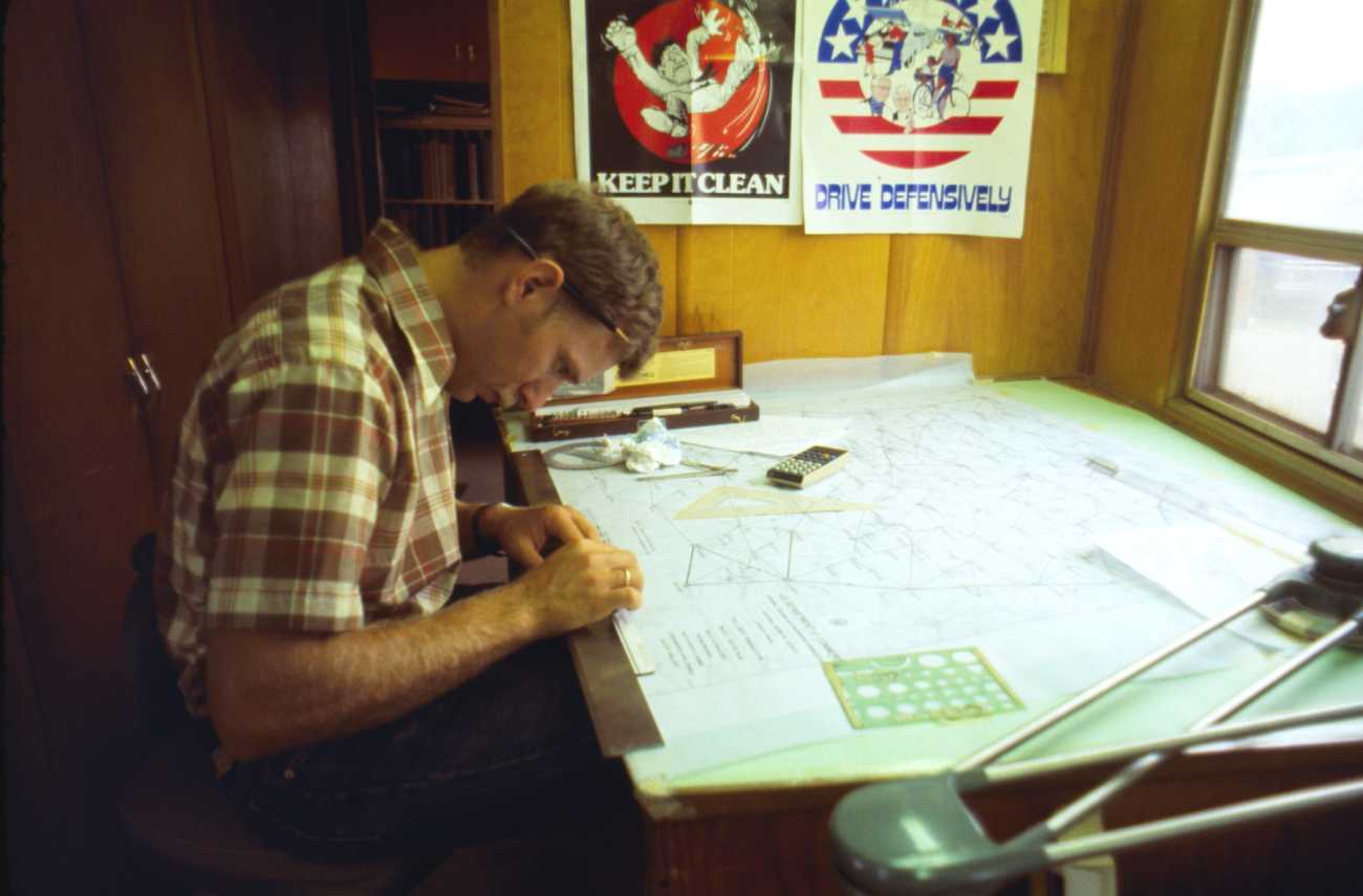 Lieutenant John Oswald preparing project sketch in Triangulation Party G-19office trailer
