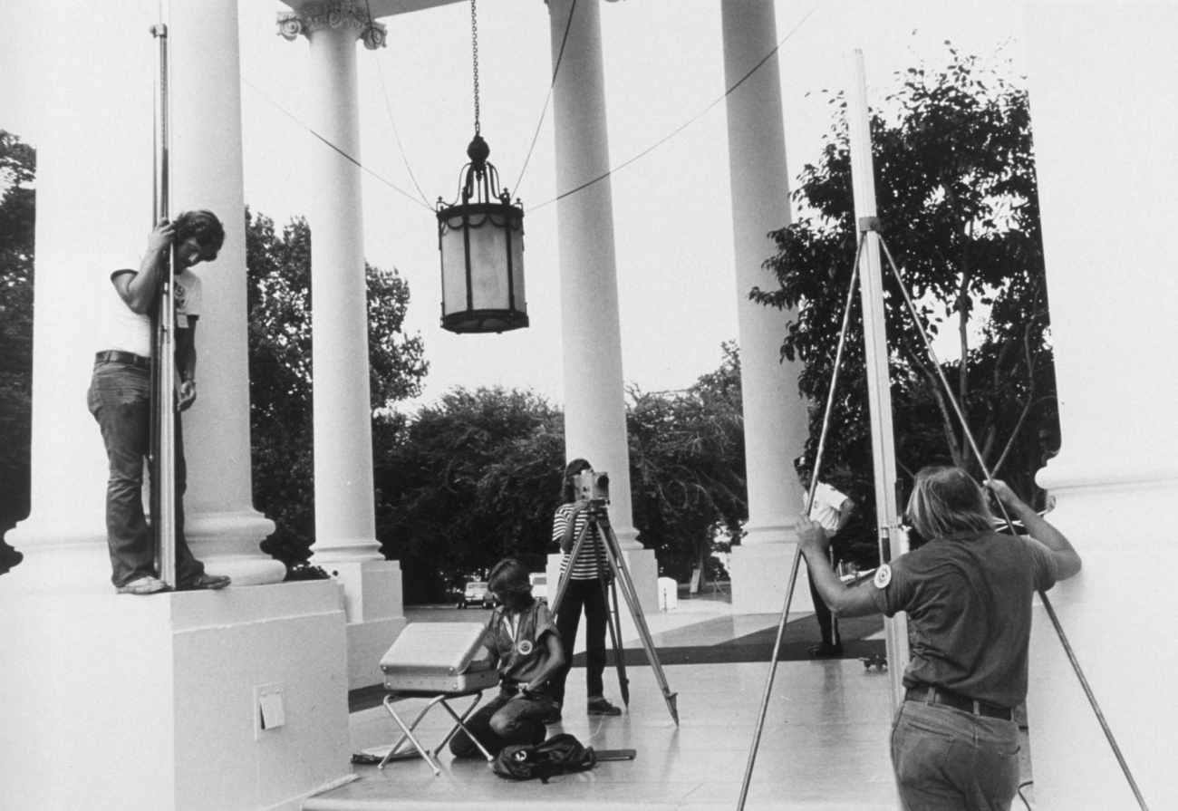 Anita Whitis conducting leveling operations on the White House North Portico