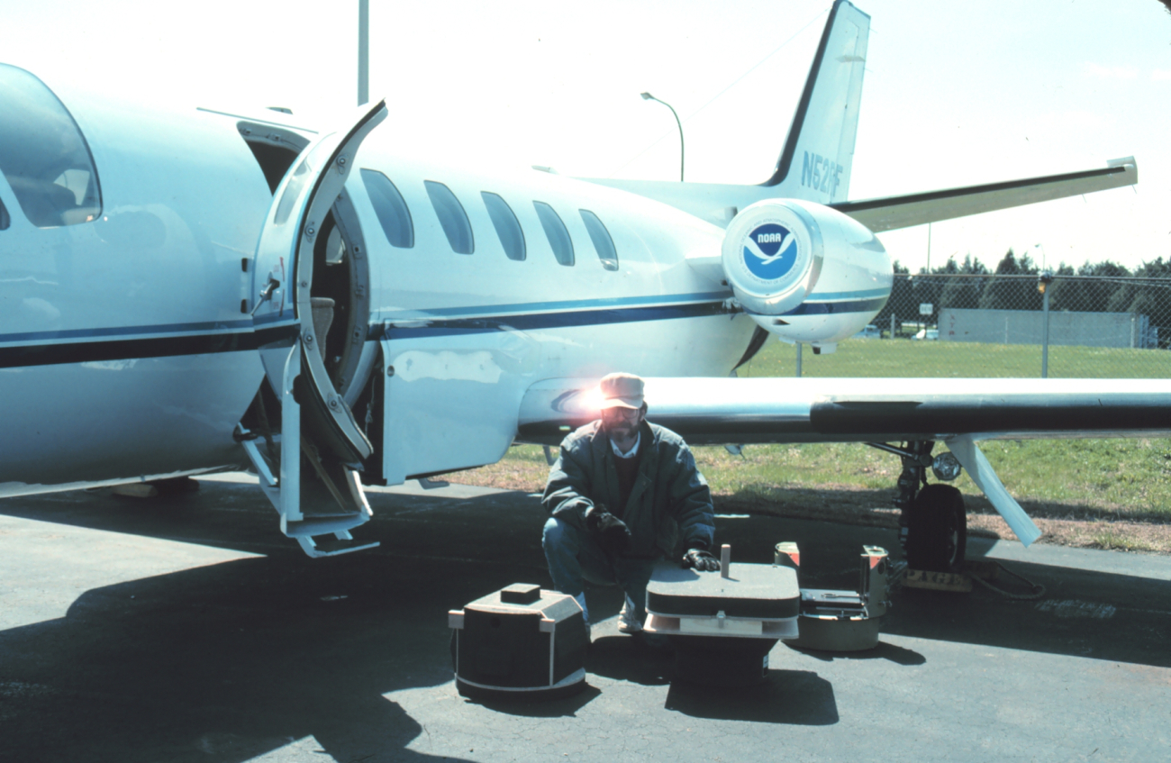 Photogrammetrist Bill Hawken preparing NOAA Cessna Citation II for mission