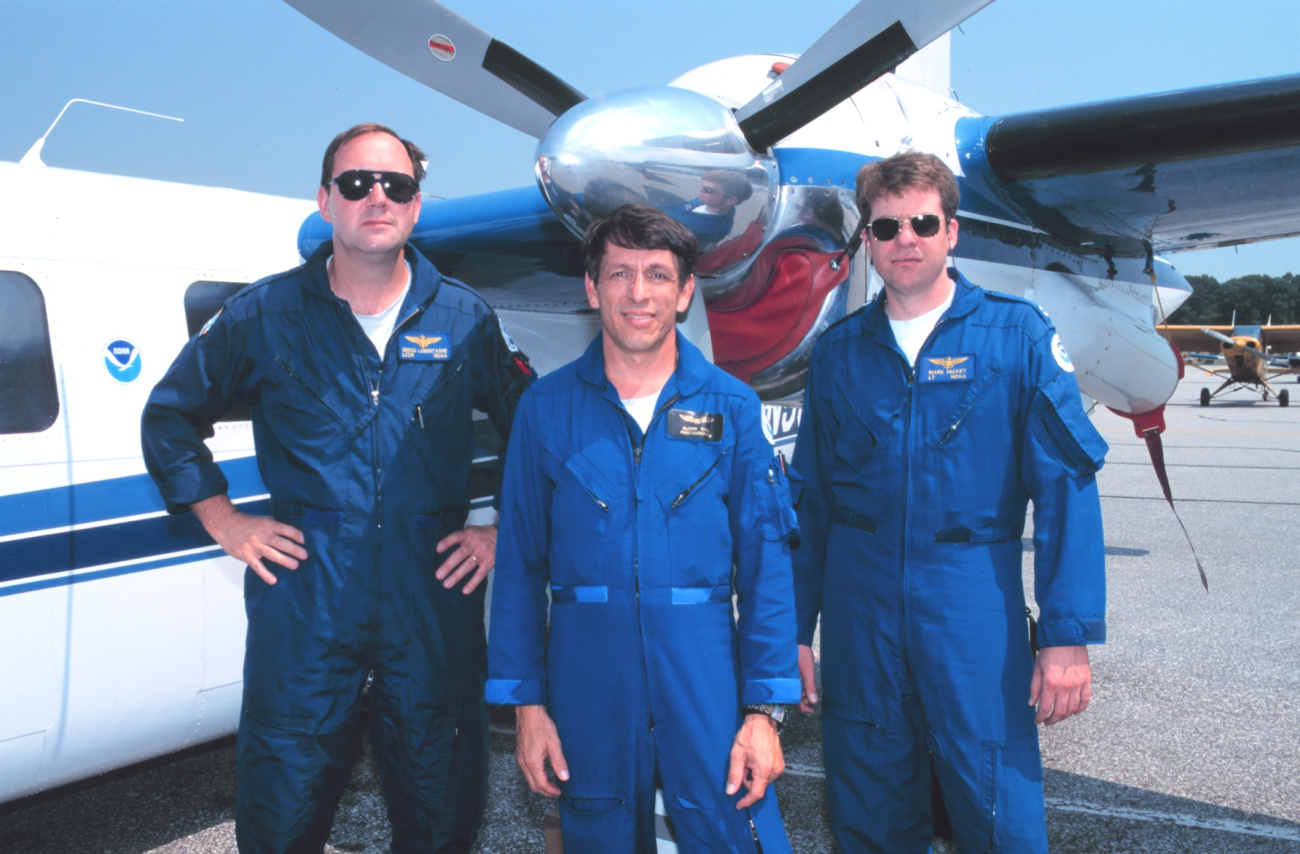 Lieutenant Commander Greg Lamontagne, Glenn King, and Lieutenant Mark Hickeyready for aerial photography on Rockwell Turbo Commander N53RF