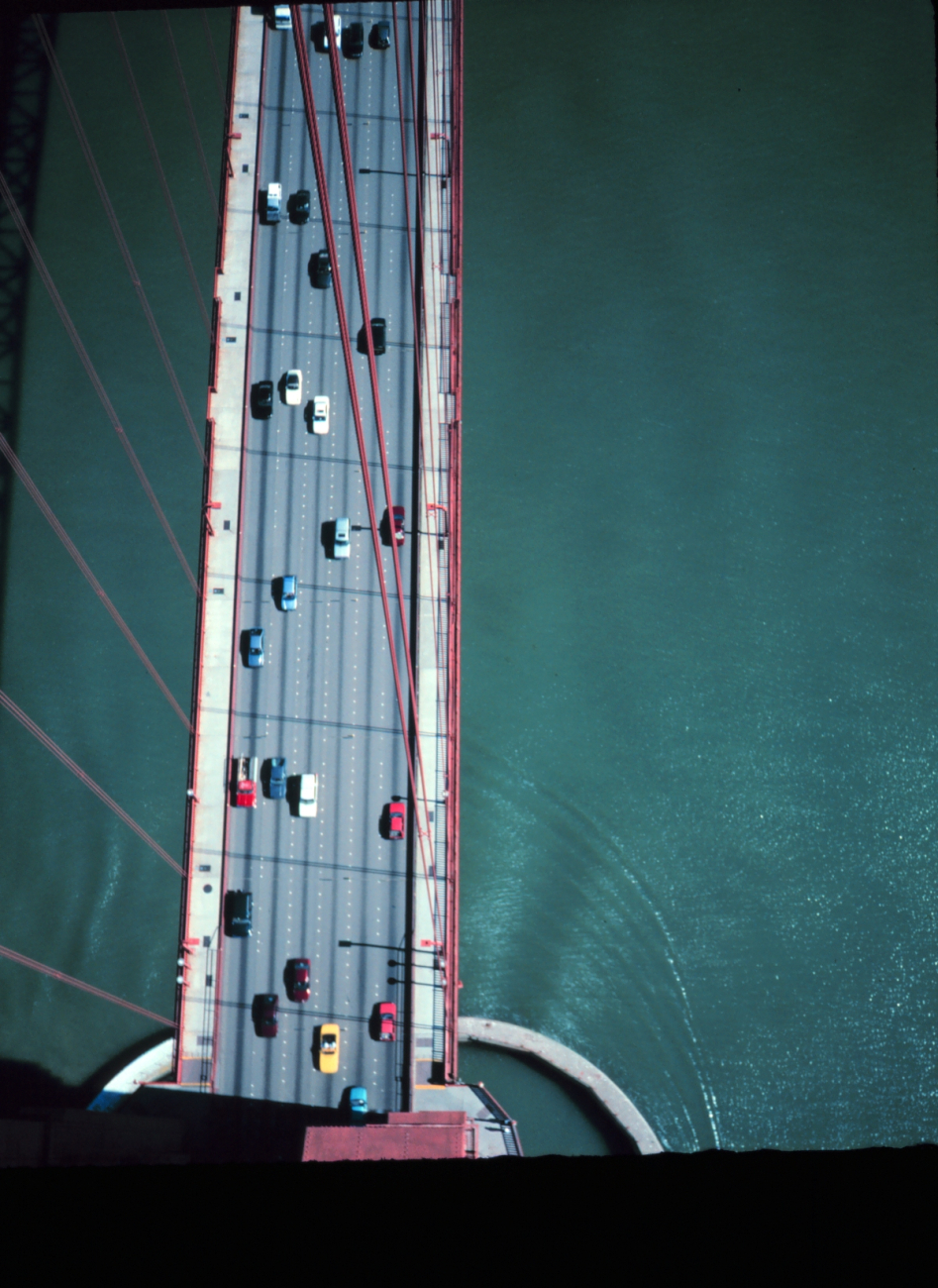 View from the top of the south tower of the Golden Gate Bridge looking down onto the deck of the bridge