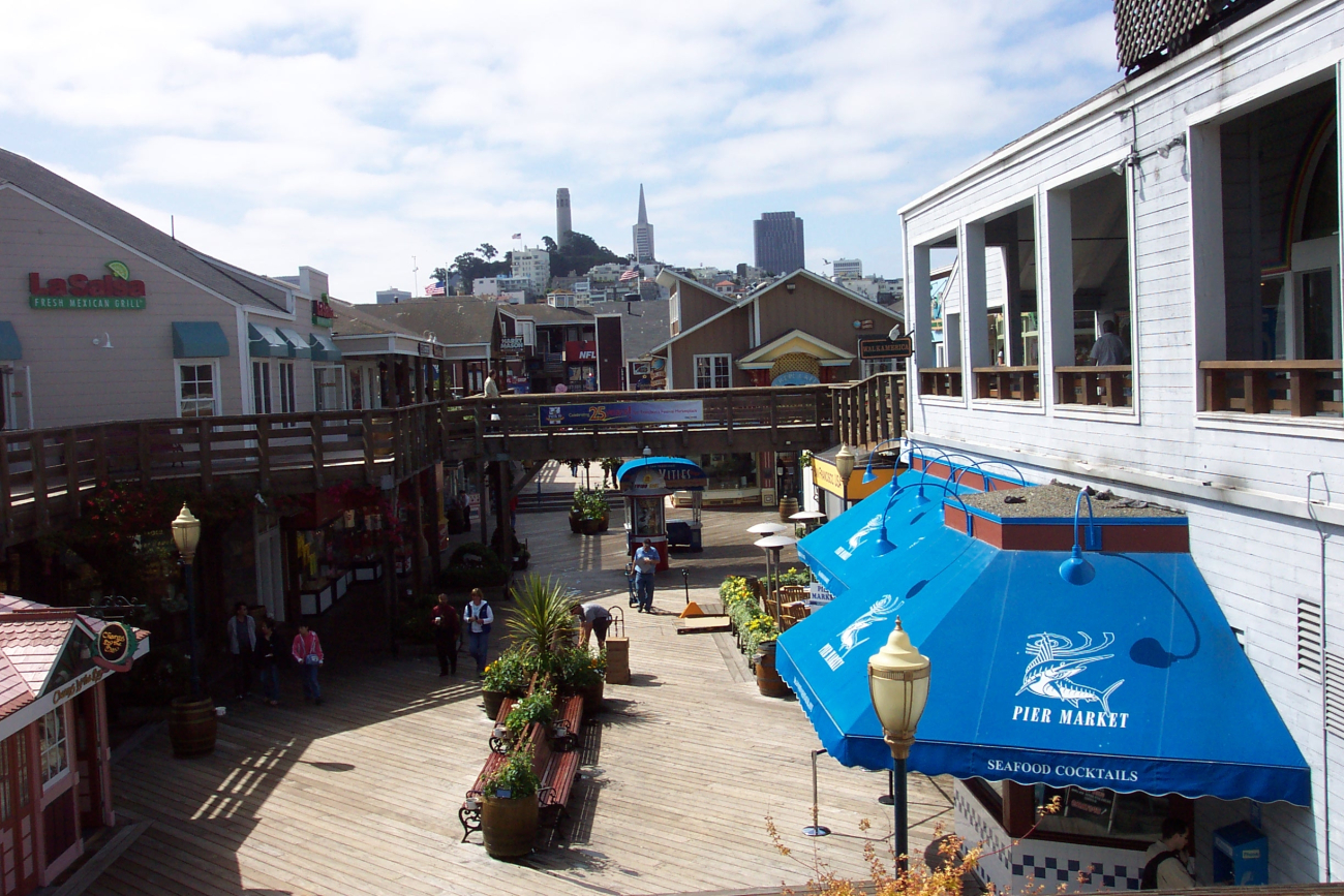 A view of Coit Tower and the Transamerica Pyramid from Pier 39 looking to thewest