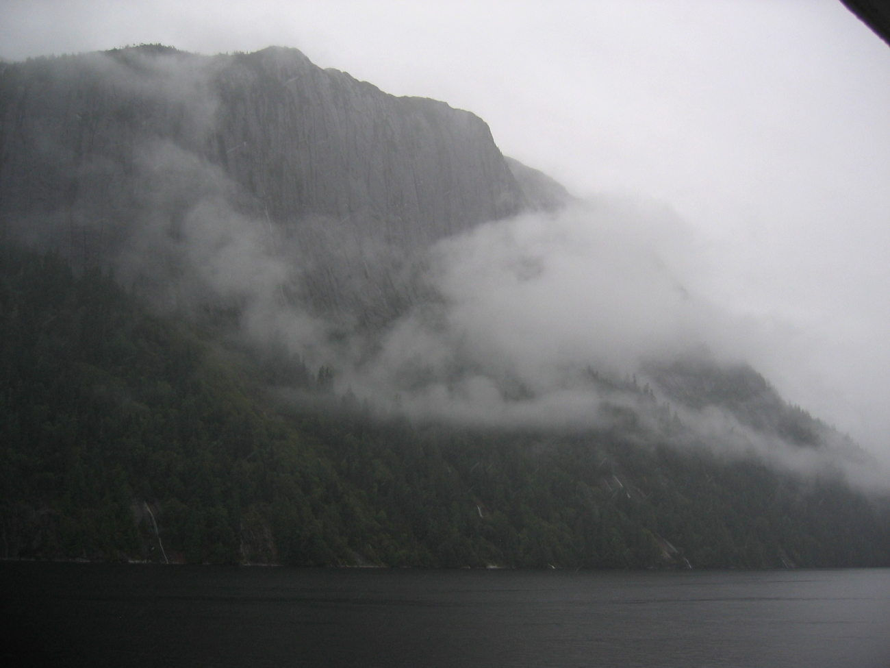 Precipitous cliffs, narrow waterways in the mist