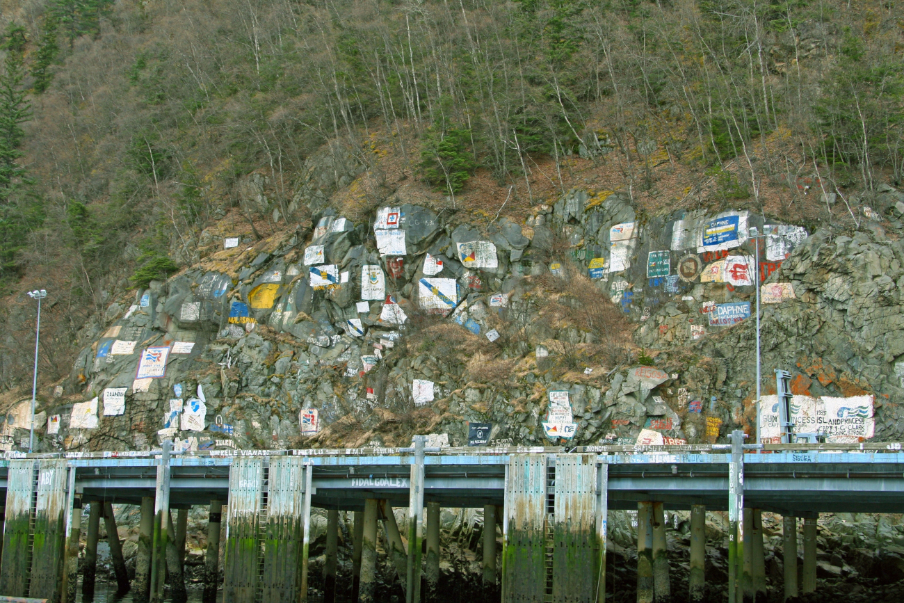 The cruise ship dock at Skagway with artwork commemorating the shipsthat have visited here