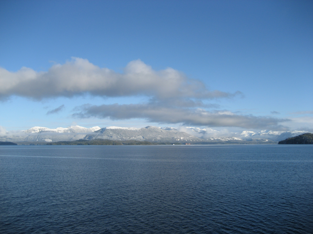 Mountains, snow, and tug and tow along the Inside Passage