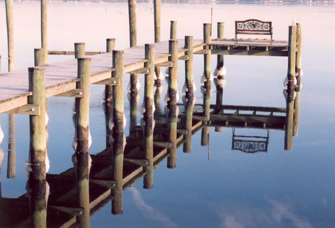 Reflections of a Patuxent River pier on a calm winter's day