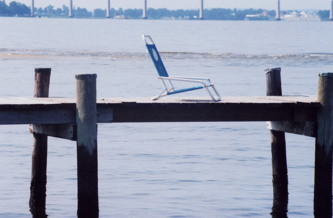 Chair waiting for occupant on a sunny summer day on the Patuxent River