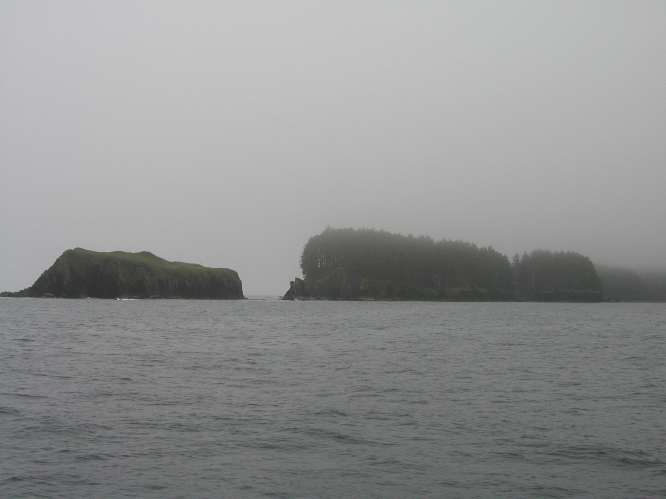Fog shrouded islets off Kodiak Island