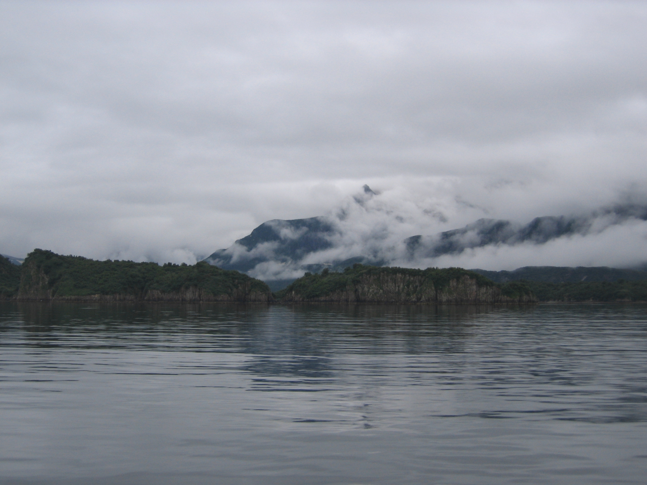 Mist-shrouded mountains over National Geographic Bay