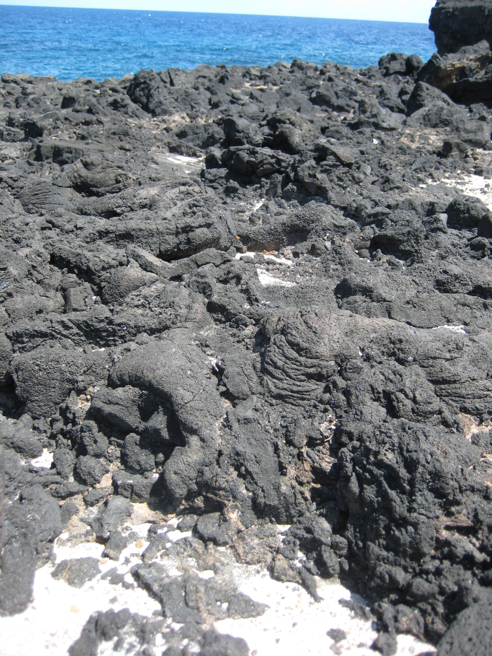 Volcanic rock formations along the coast at Moano o sina