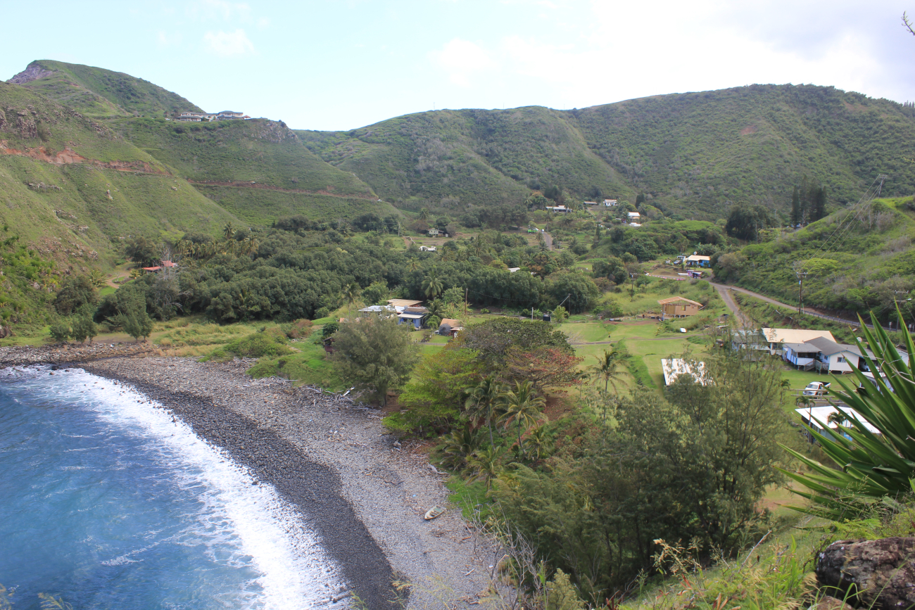 A rural settlement along the Maui coast with a cobble beach lining a quiet cove