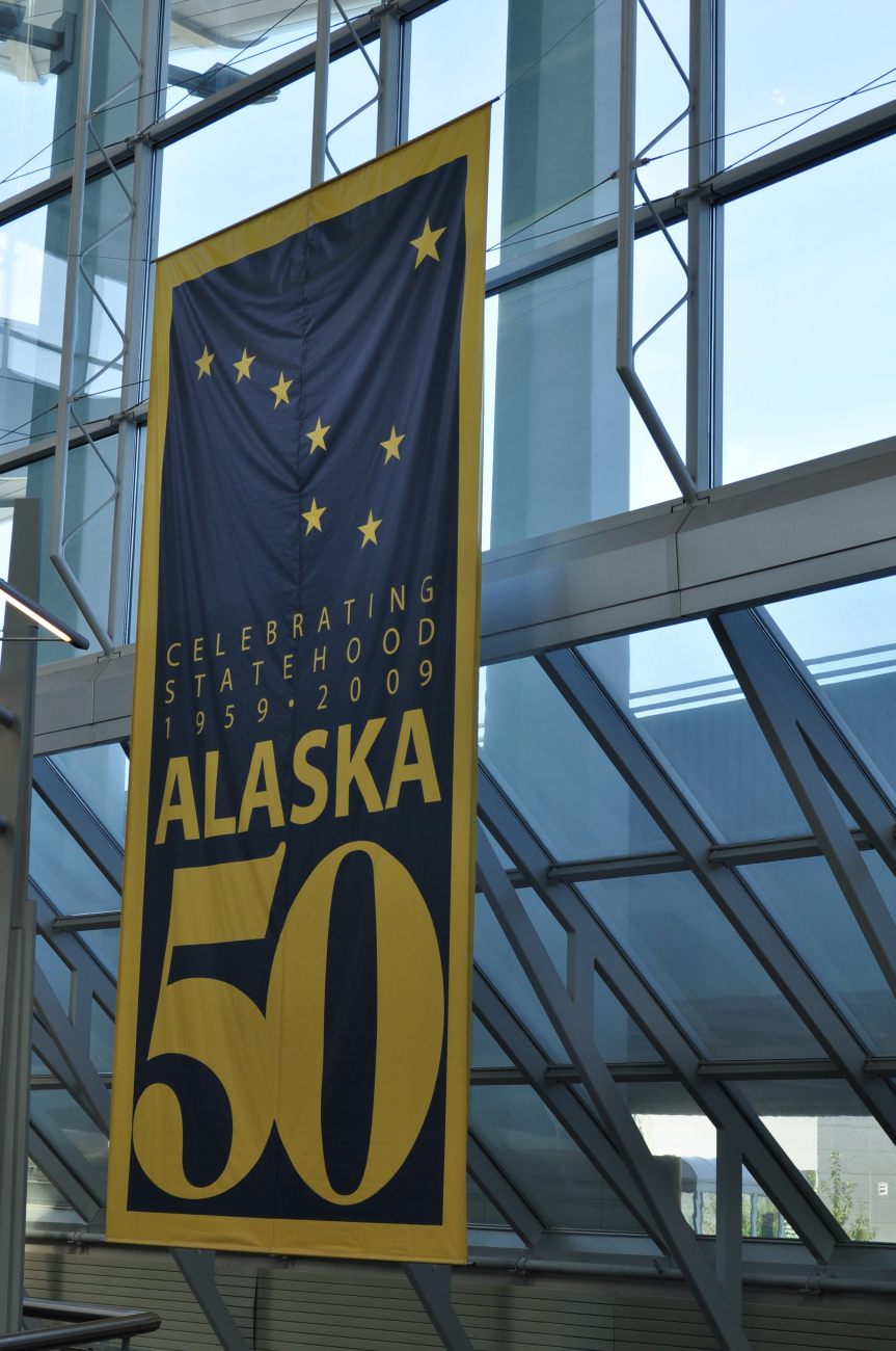 Sign at Anchorage Airport celebrating 50 years of Statehood