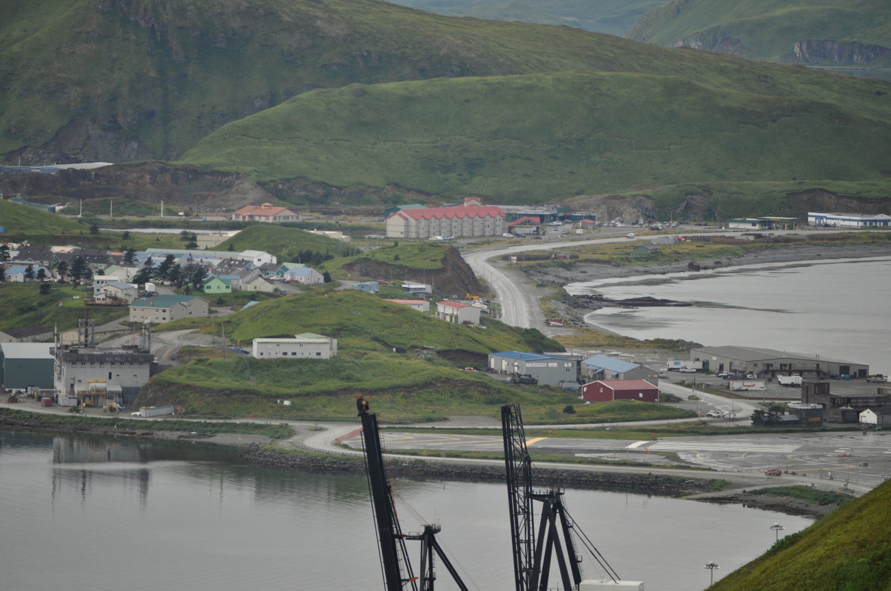 Looking over the American President Lines container cranes to the end of theDutch Harbor Airport runway and the Grand Aleutian Hotel