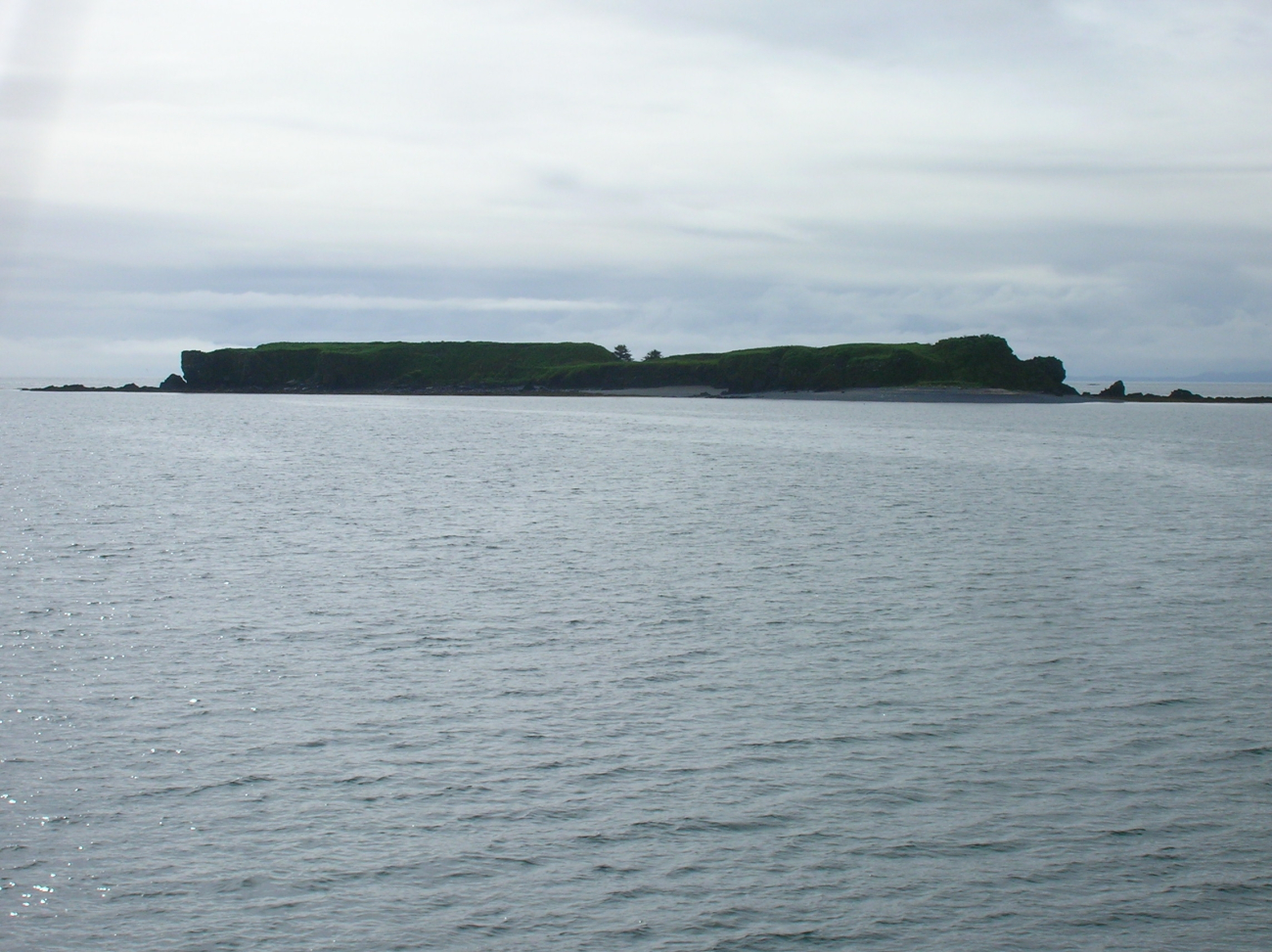 A flat-topped island seen departing Kodiak