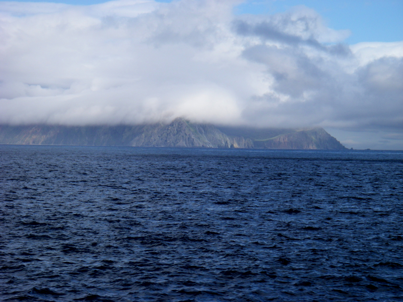 A cloud enshrouded Aleutian Island coastline