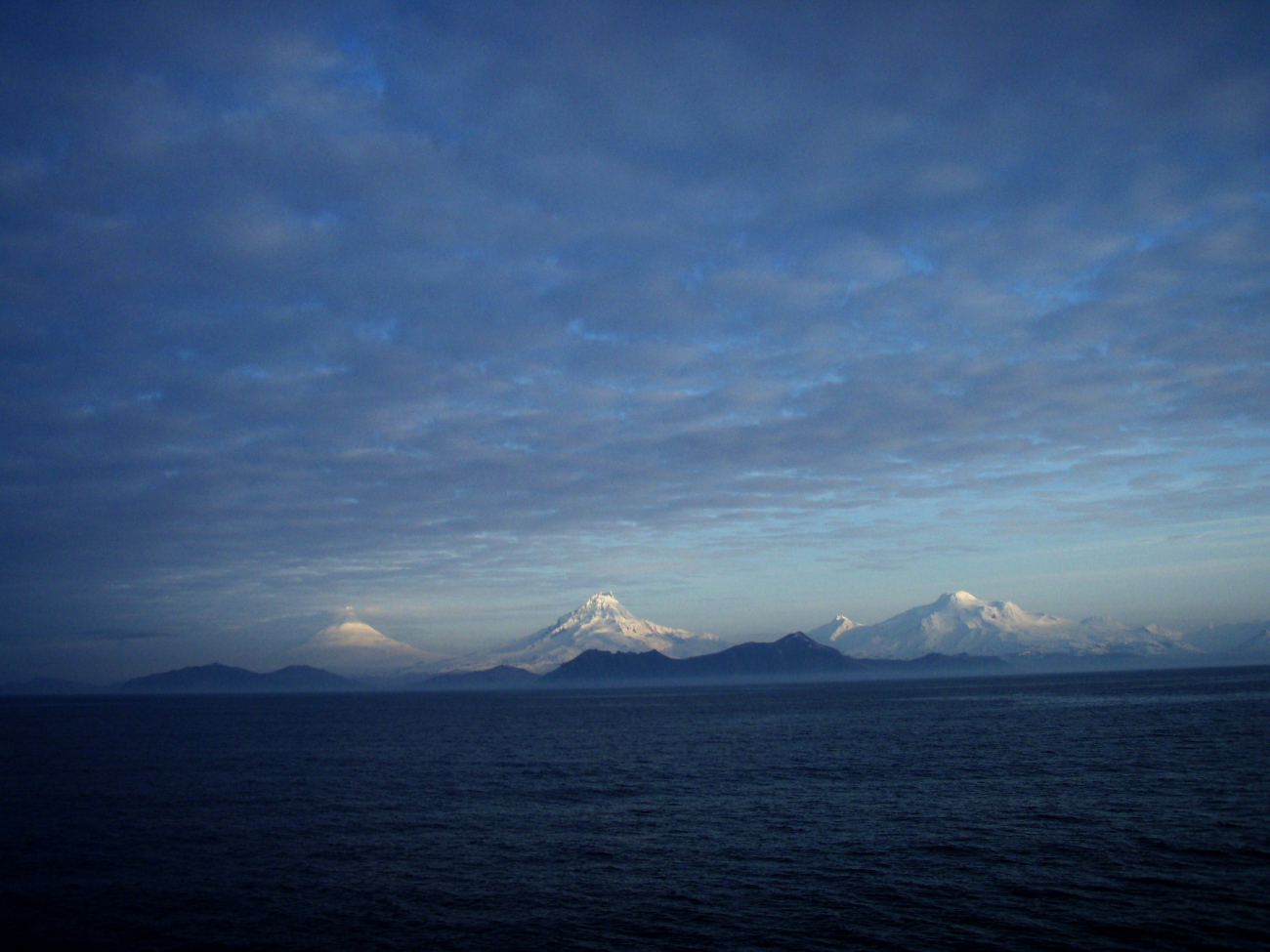 Shishaldin, Isanotski, and Roundtop Volcanoes seen from the Pacific side ofUnimak Island