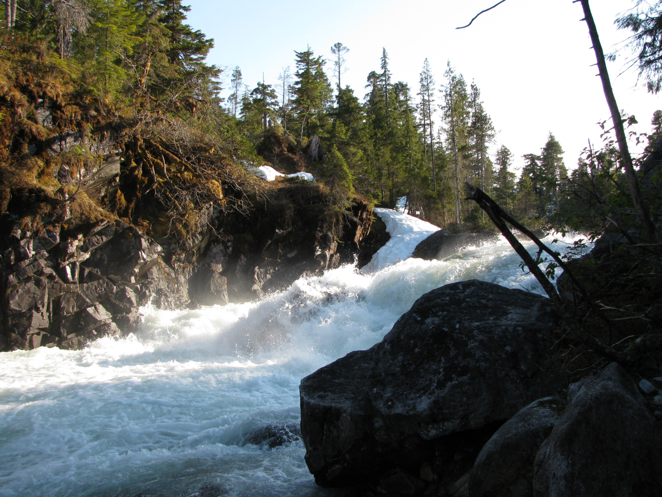 Baranof River waterfalls as they enter Warm Springs Bay