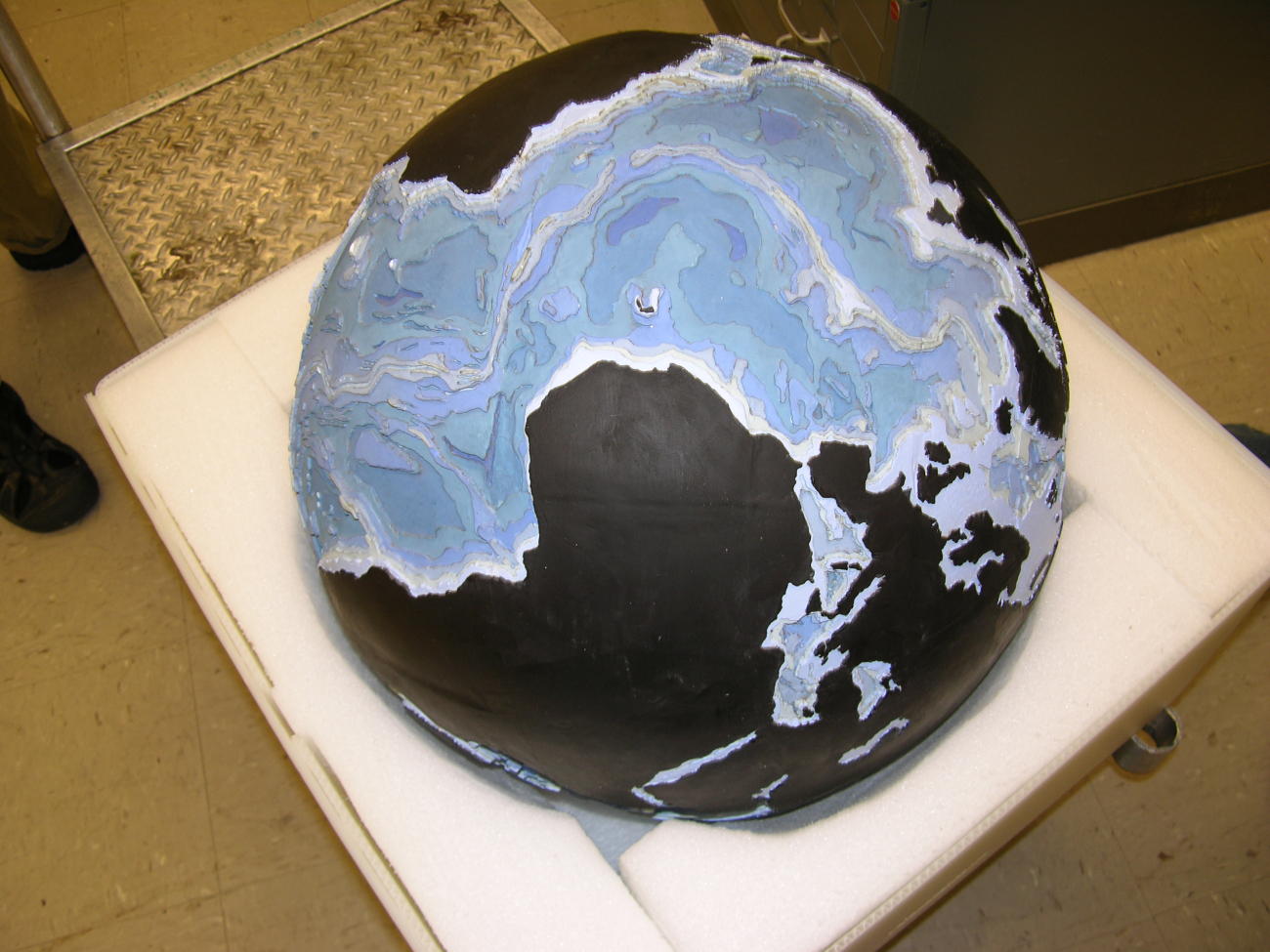 Stages in the production of the famous basketball bathymetric globe produced byBruce Heezen and Marie Tharp in their quest to understand the physiography ofthe seafloor