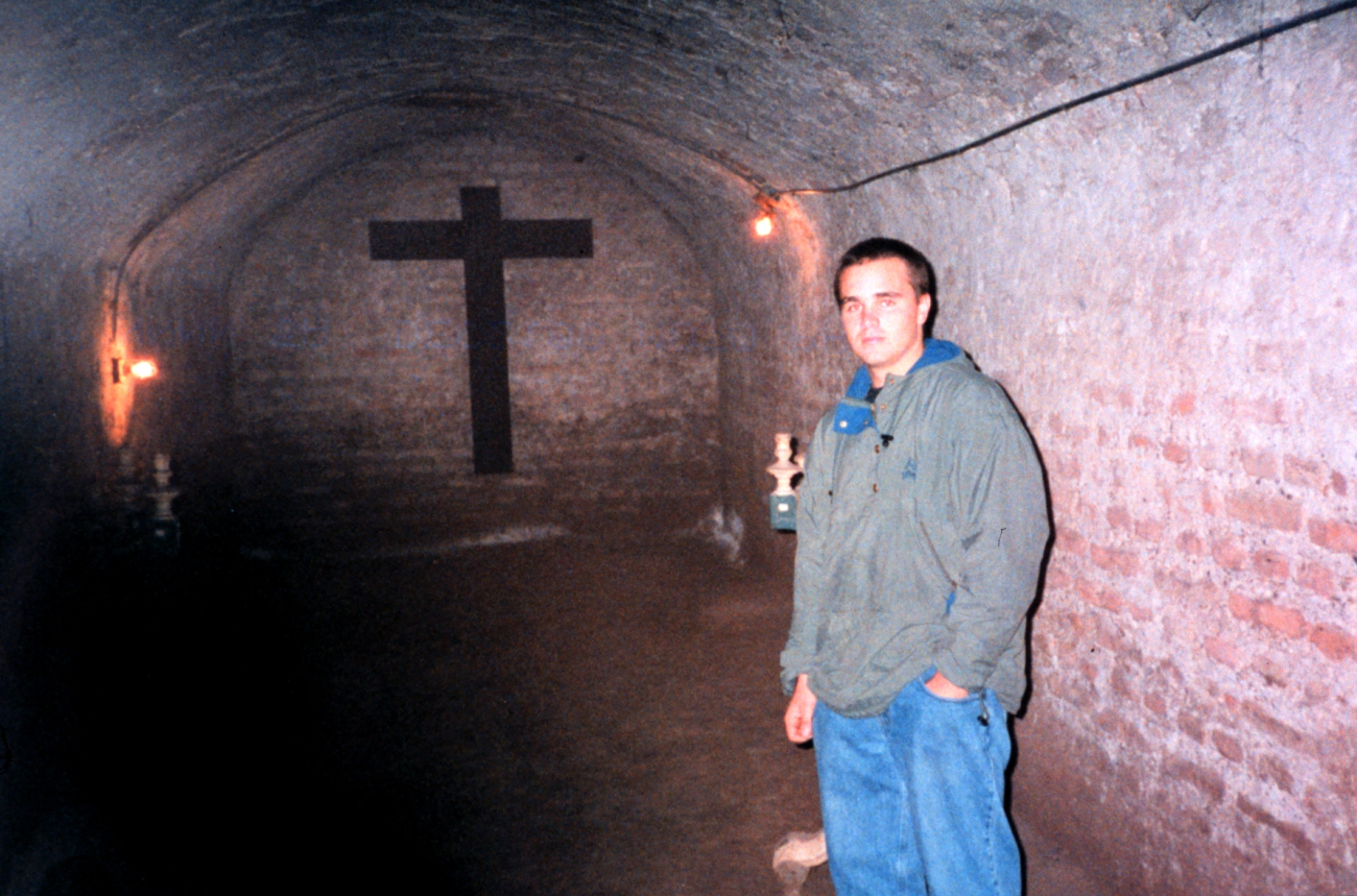 Deck hand Mike Theberge in the catacombs area of a Lima cathedral