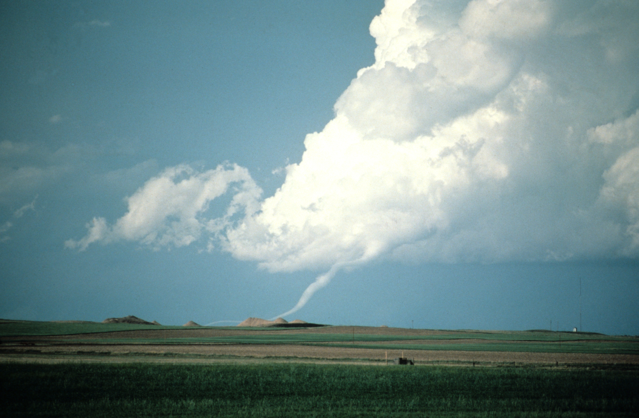 Roped-out tornado visible in the distance