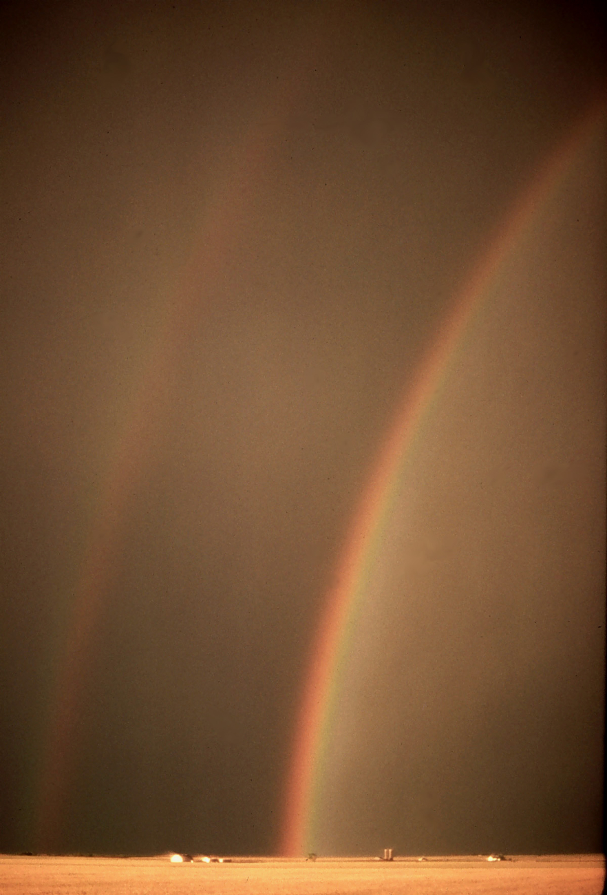Rainbow with reflection over an Oklahoma wheatfield
