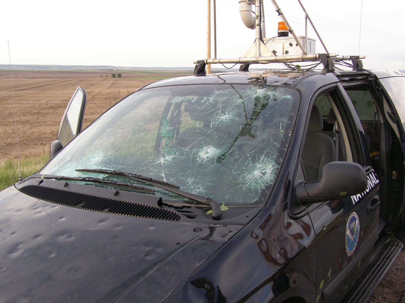 The tornadic storm observed earlier was accompanied by largedangerous hail which smashed the windshield of this National Severe StormsLaboratory instrumented vehicle