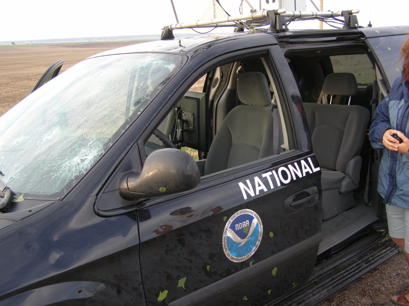 The tornadic storm observed earlier was accompanied by largedangerous hail which smashed the windshield of this National Severe StormsLaboratory instrumented vehicle