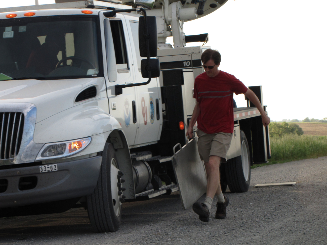 NSSL's Ted Mansell pulls out plates to help stabilize the NOAA X-Polmobile radar