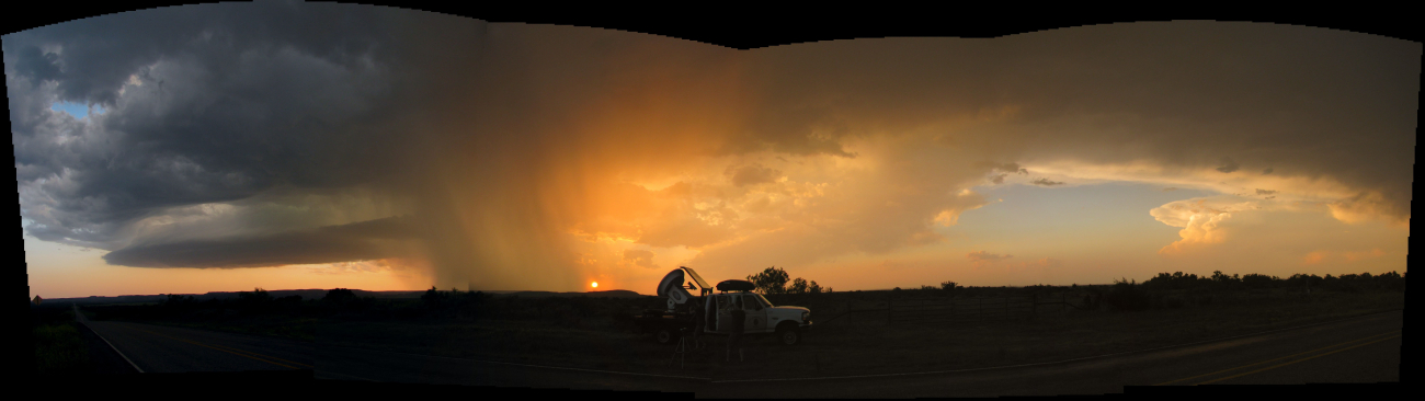 Composite photo of rain shaft in a setting sun