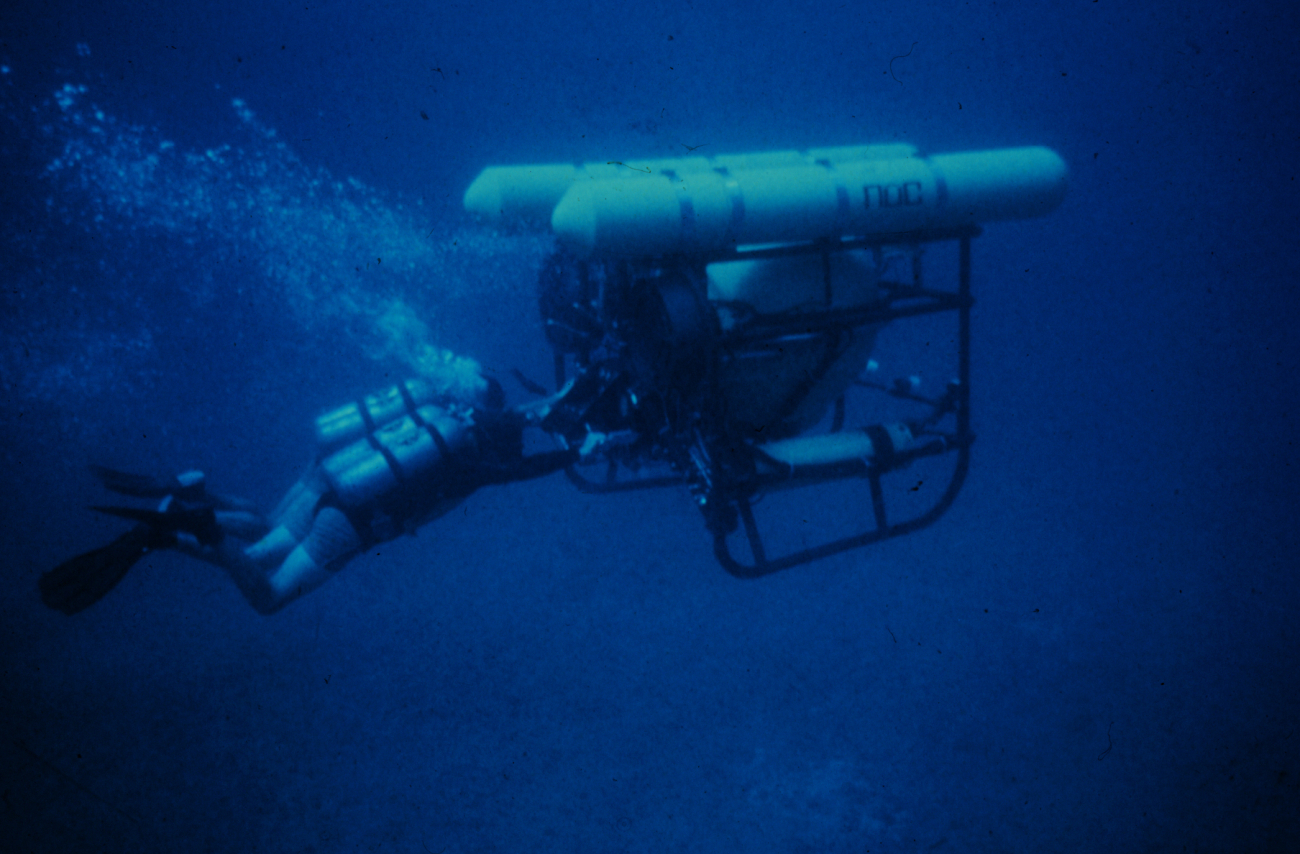 Divers use a two person diver propulsion vehicle