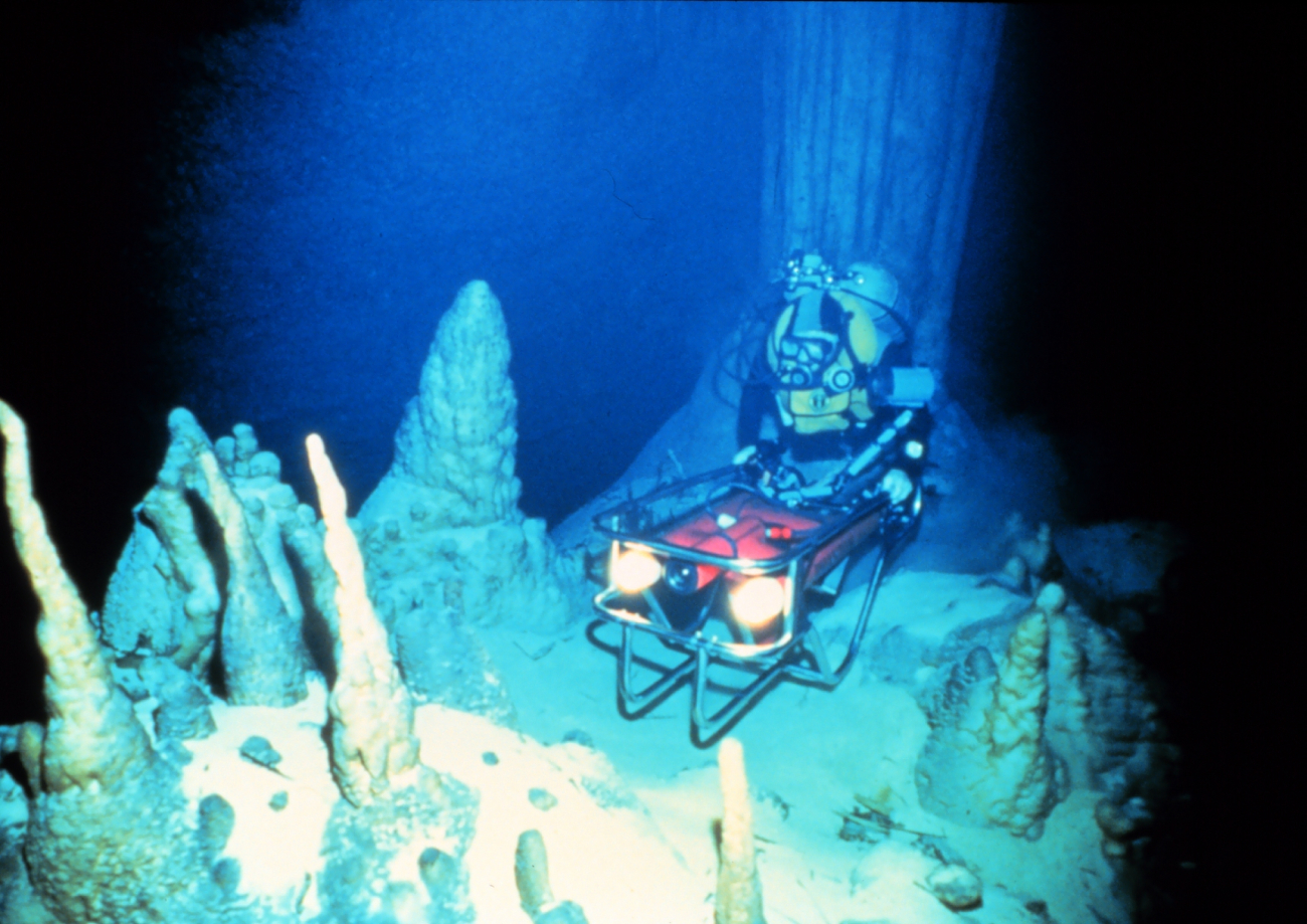 Spelunking cave diver towed by Phantom ROV