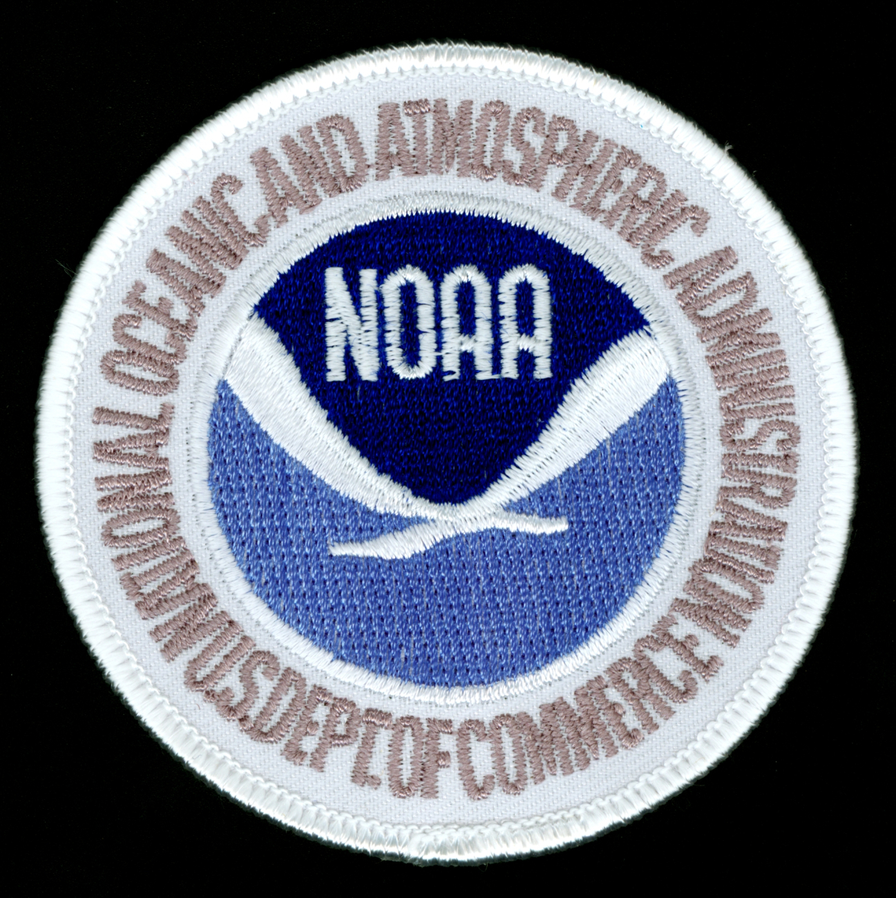 An alternate NOAA patch with gold lettering surrounding the NOAA emblem