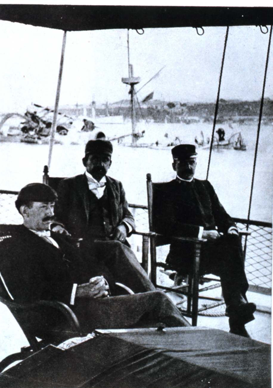 Unidentified officers sitting on the stern of the Coast and Geodetic Survey ShipBACHE in Havana Harbor on February 16, 1898