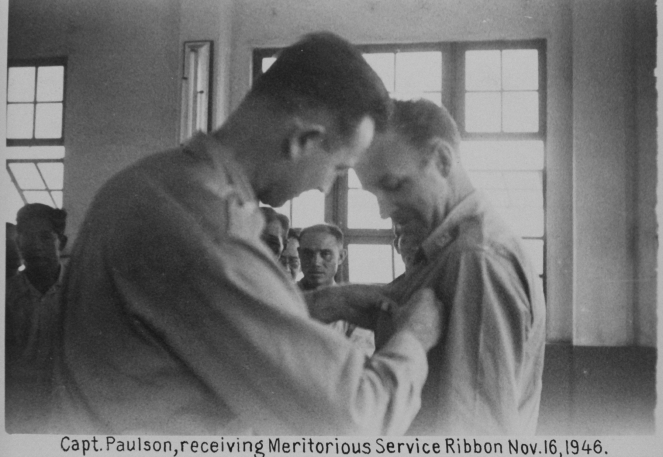 Major Marvin Paulson receiving Army Meritorious Service Ribbon for service inthe Philippines helping in the reconstruction, clearing, and recharting ofManila Bay and helping re-establish the Philippine Coast Survey