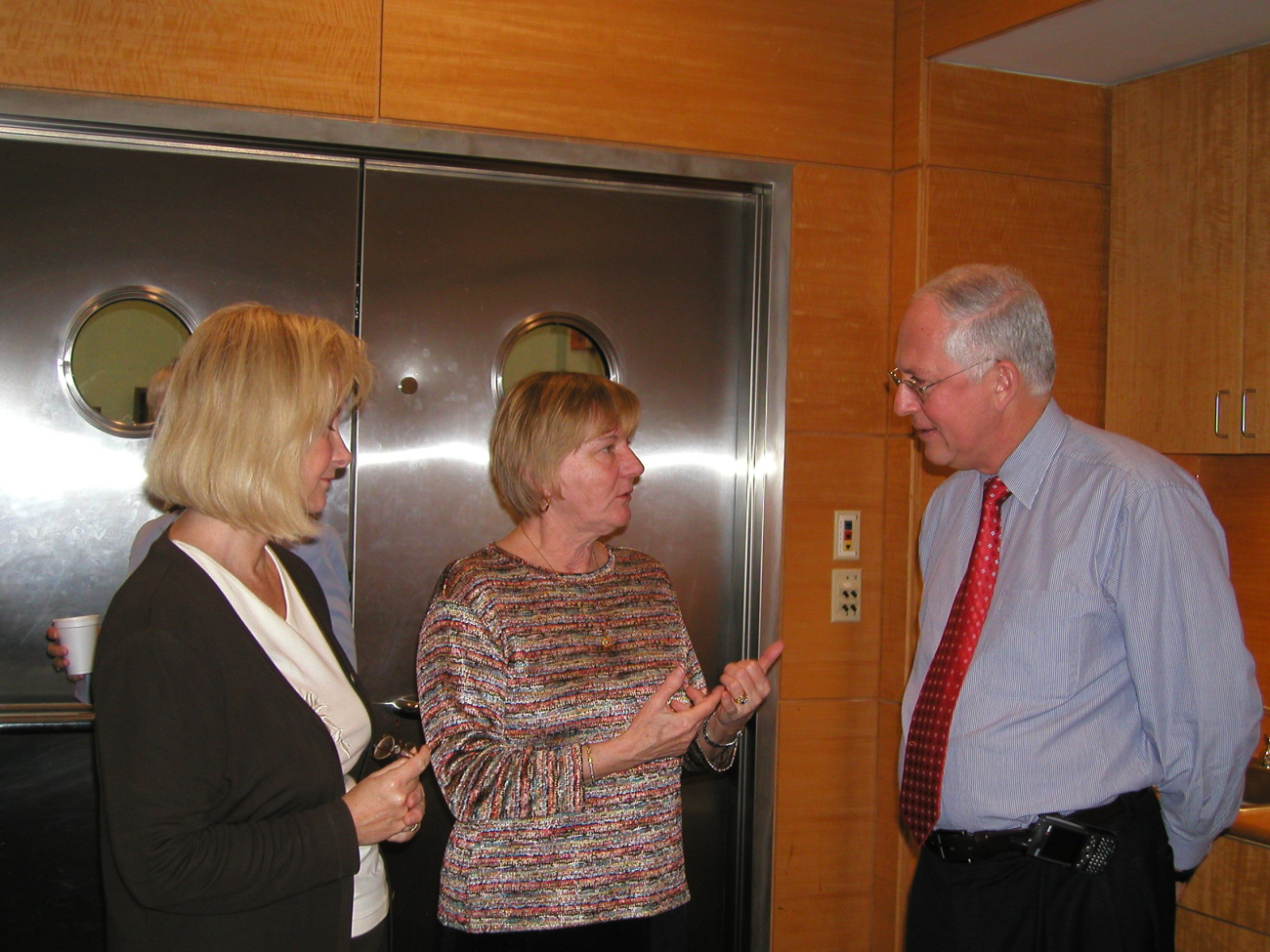 Linda Pikula, head of the NOAA Miami Regional Library, and Janice Beattie (center), Director of the NOAA Central Library, speak with Dr